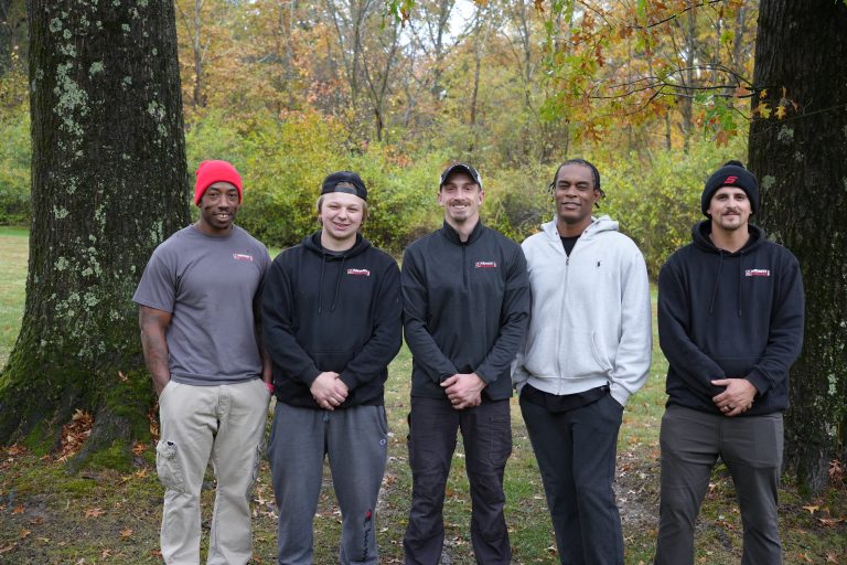 Group of movers standing outdoors in akron ohio