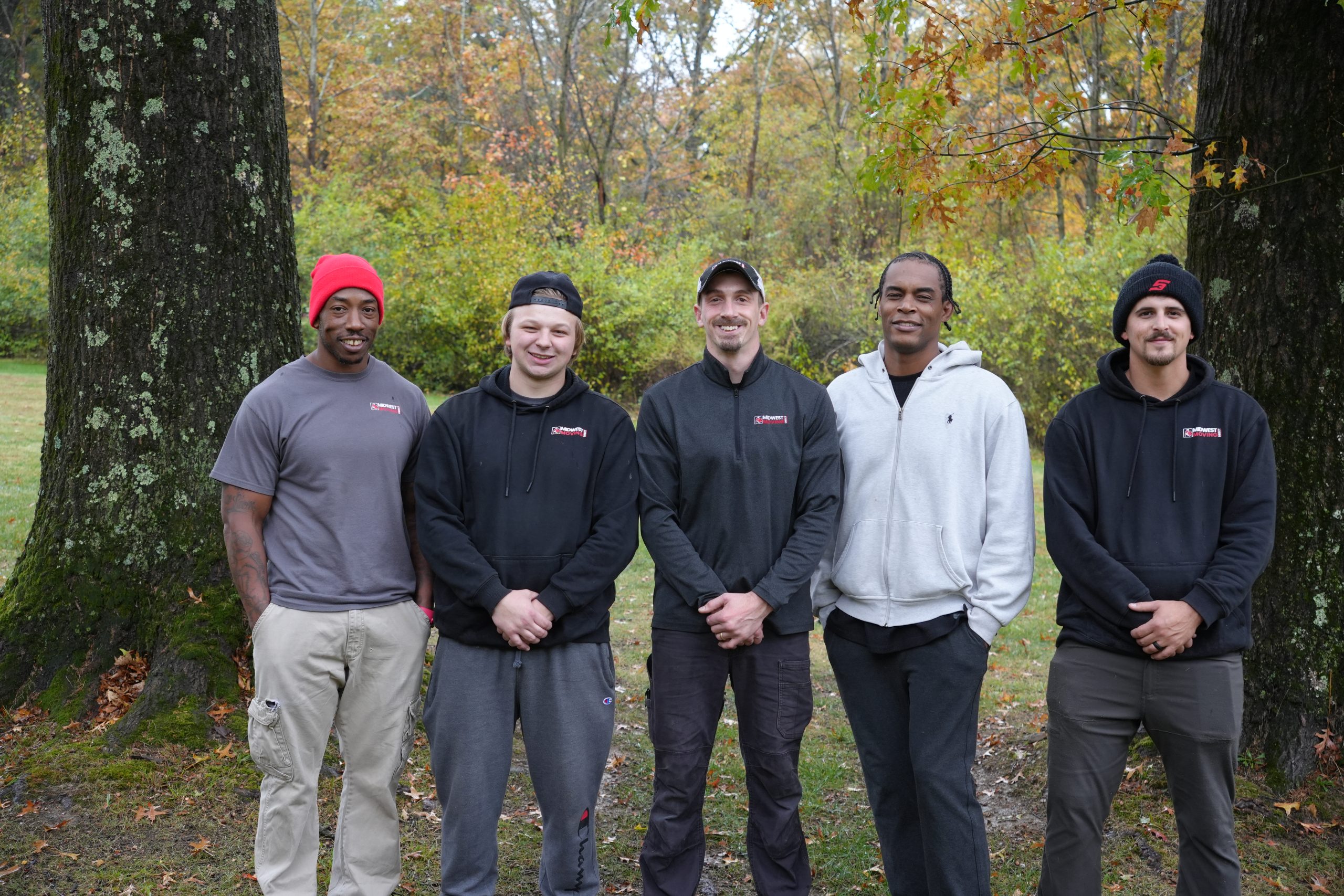 Group of movers standing outdoors in akron ohio